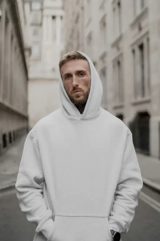 Free Men Wearing Hoodie Against The City Mockup